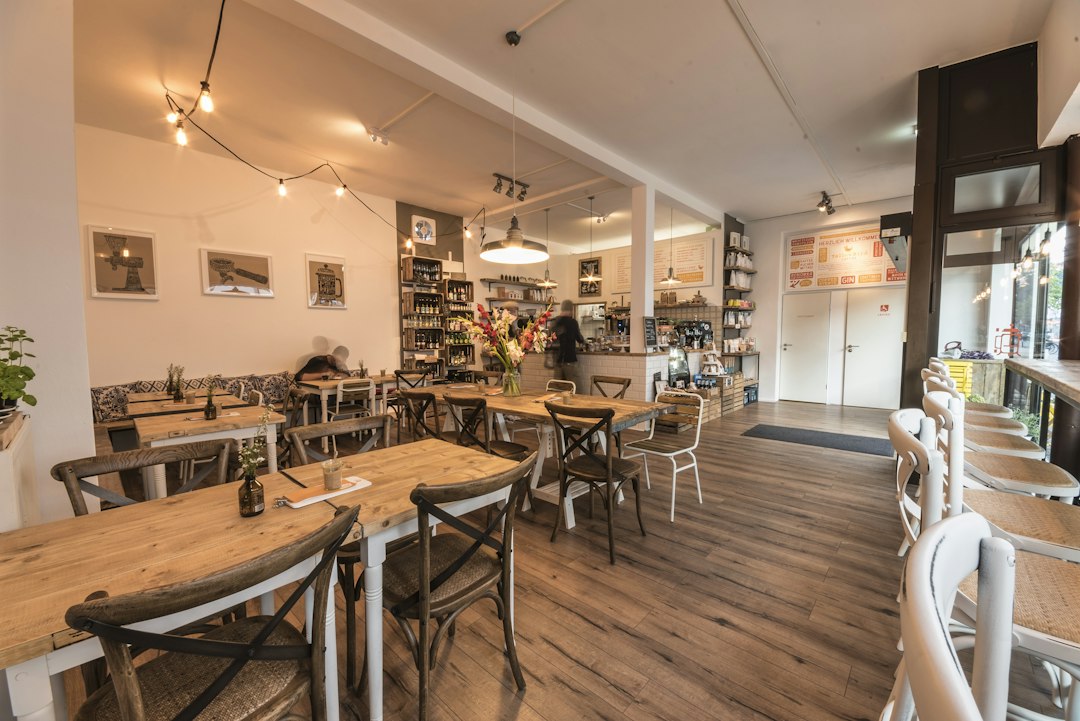 Cafe interior with dining tables and a service counter